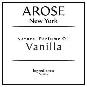 10ml roll-on bottle of Arose NY Vanilla Perfume Oil styled with vanilla pods and caramel swirls – warm, unisex, and alcohol-free fragrance.